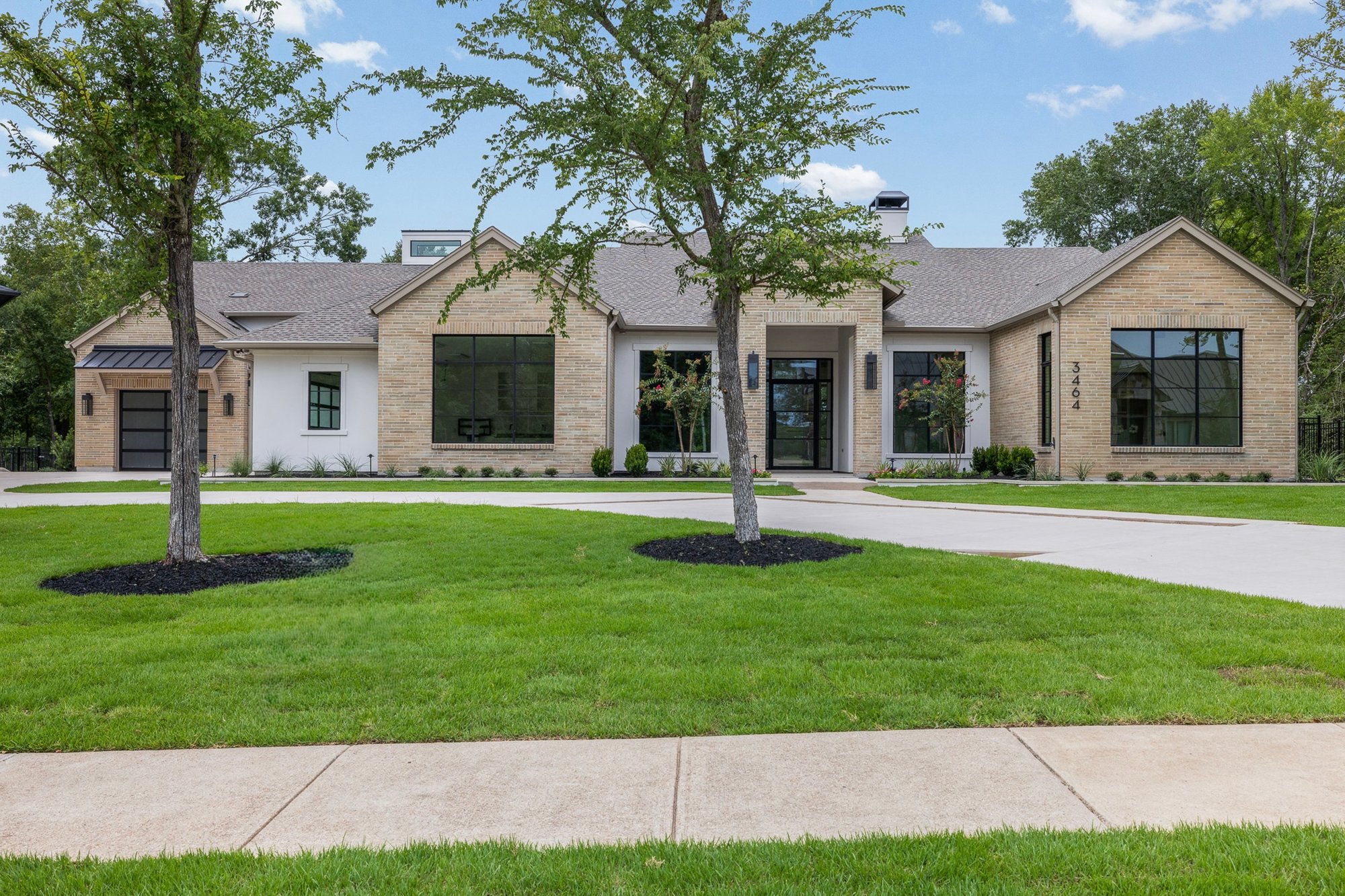 Front exterior of a custom country club home built by Southern Green Builders in Traditions Club
