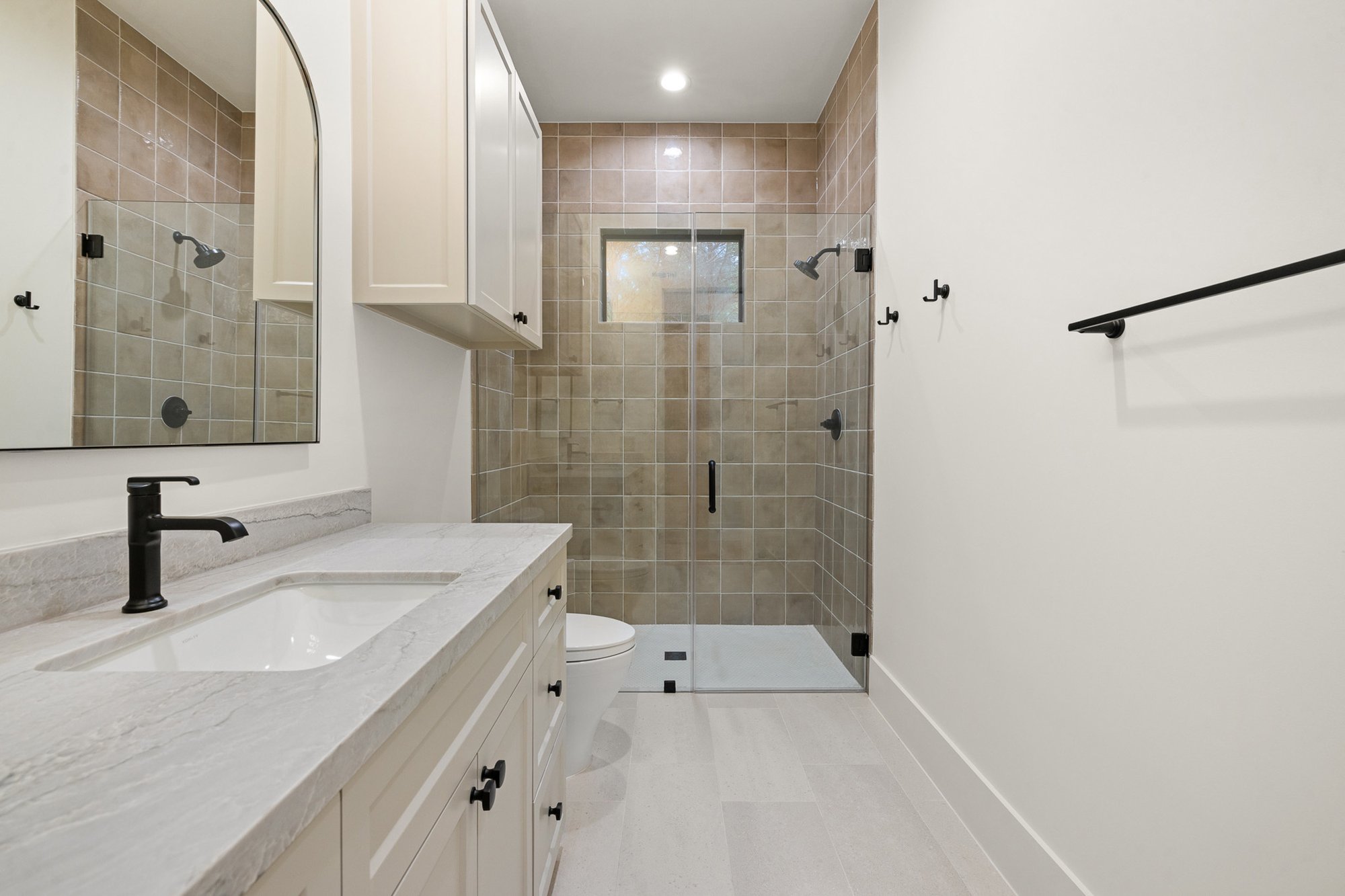 Custom bathroom featuring premium finishes and designer fixtures