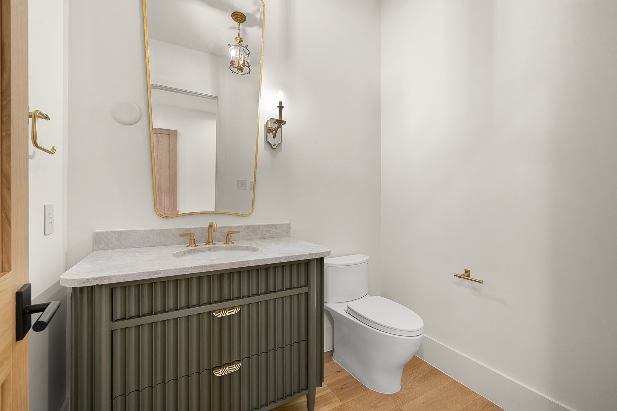 Elegant powder bathroom with custom vanity and lighting