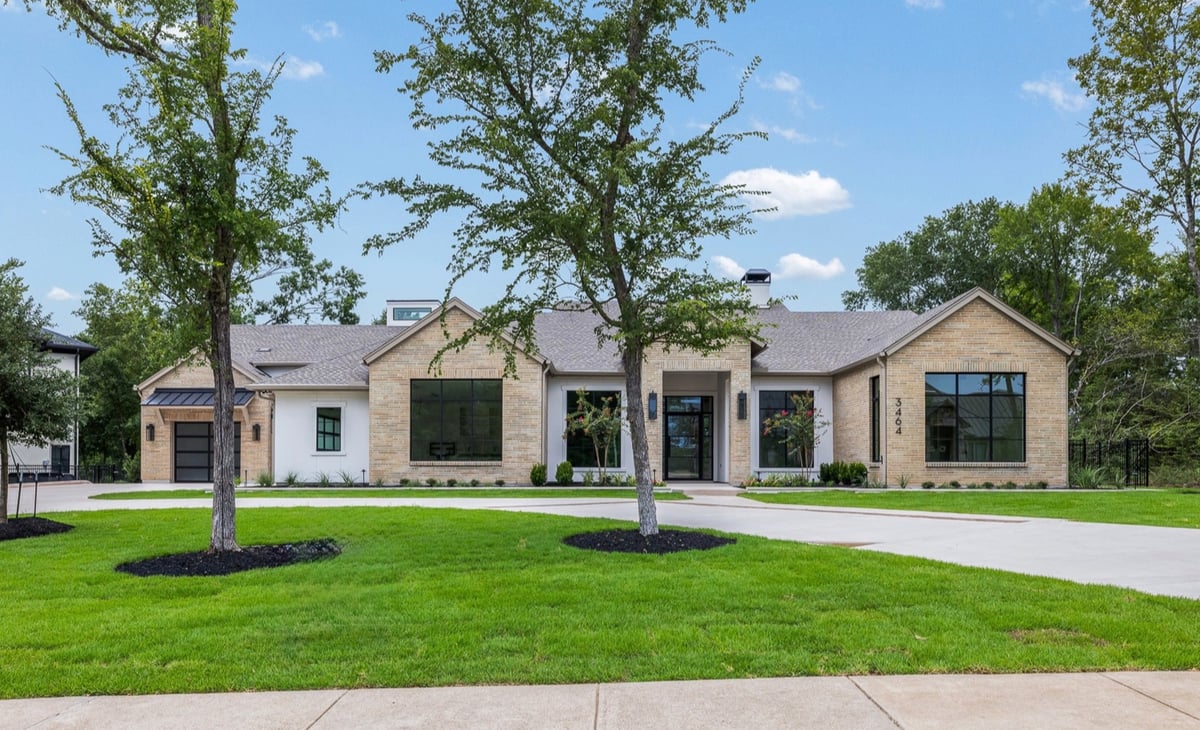 Front exterior of a custom country club home built by Southern Green Builders in Traditions Club