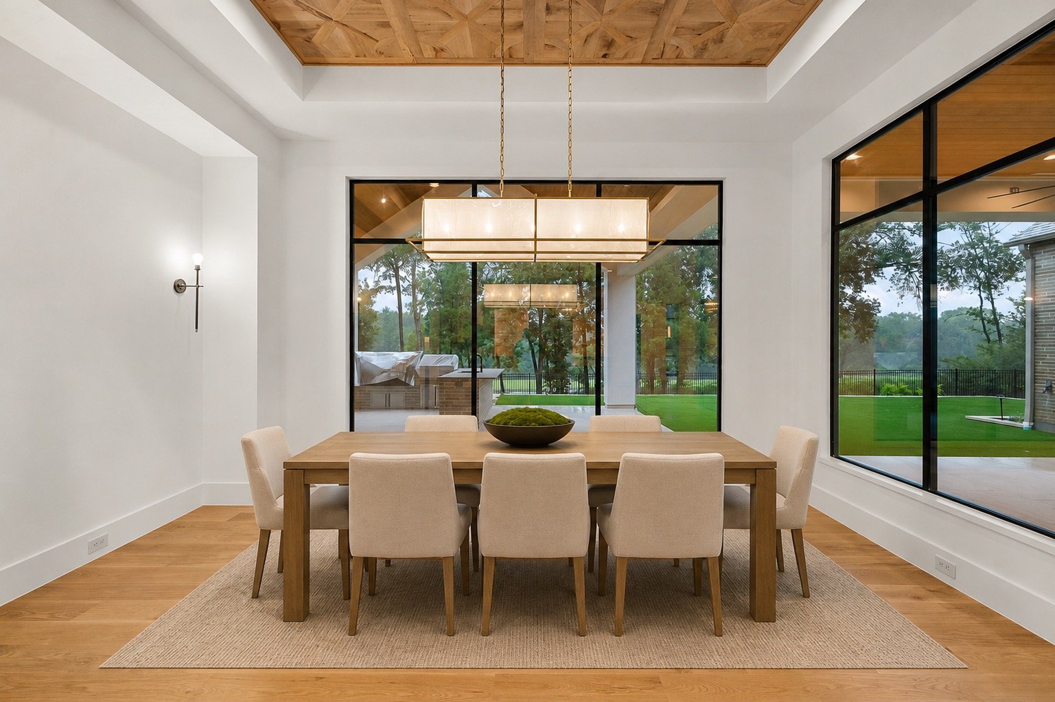 Formal dining room with elegant lighting and custom architectural details