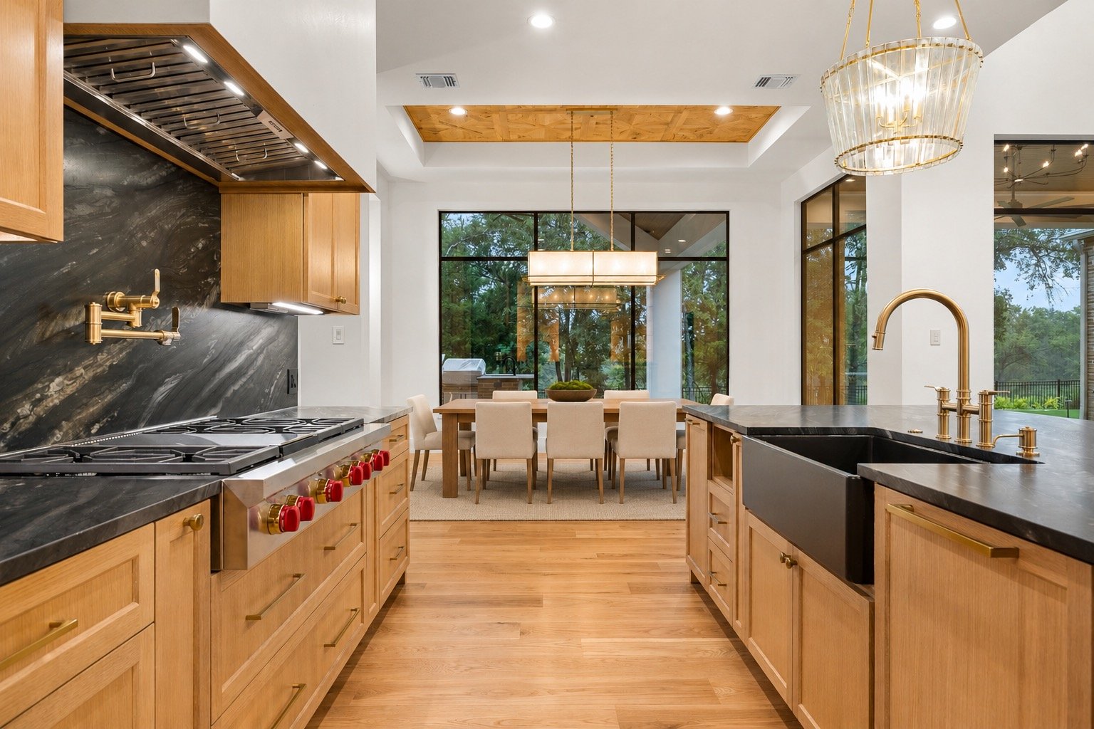 Custom stained white oak cabinetry and designer finishes in the kitchen
