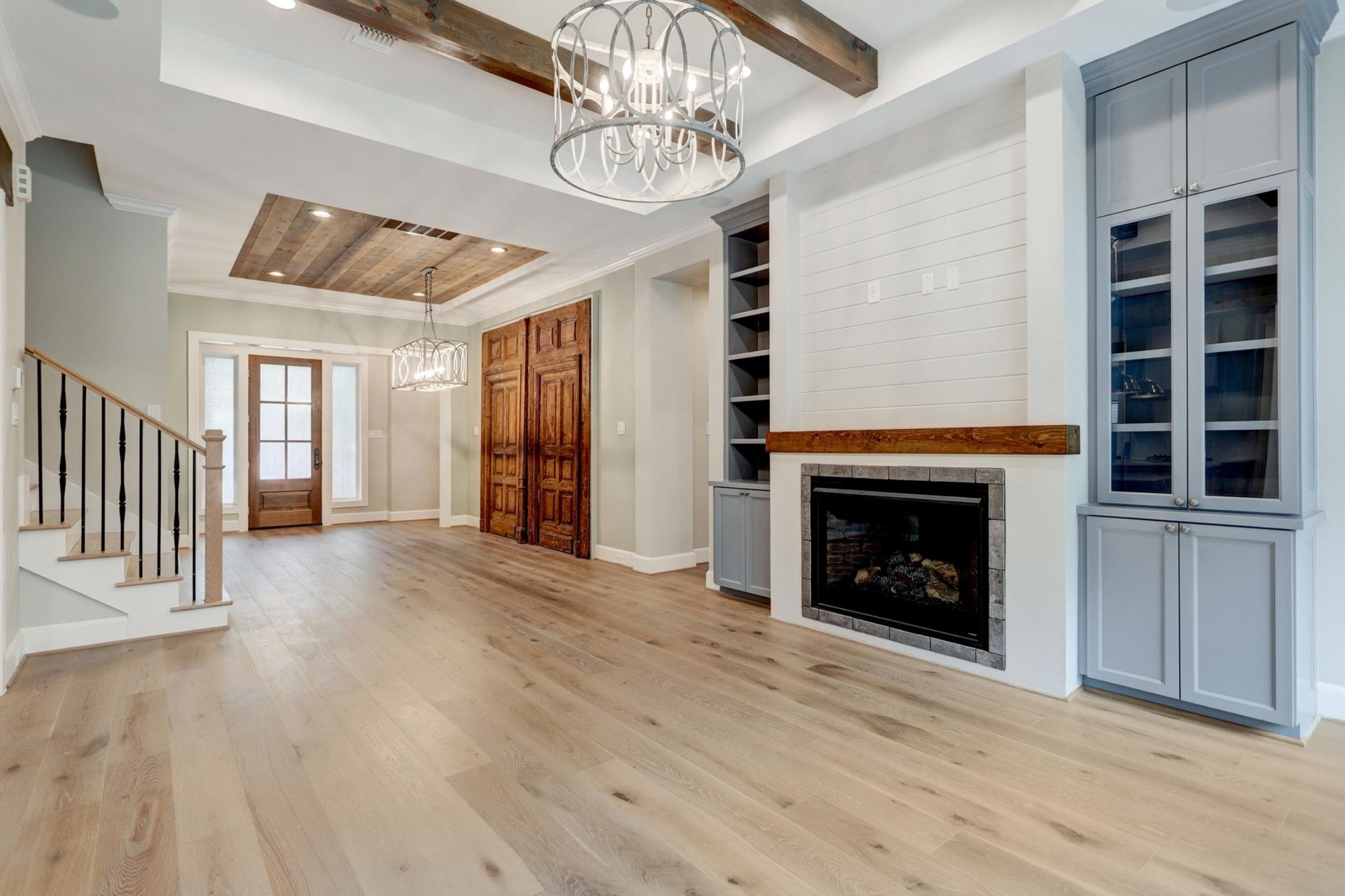 Beautiful Living Room with White Tile Walls and Built-in Fireplace