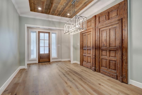 Beautiful Reclaimed Wood Doors Featured Near the Entrance Way