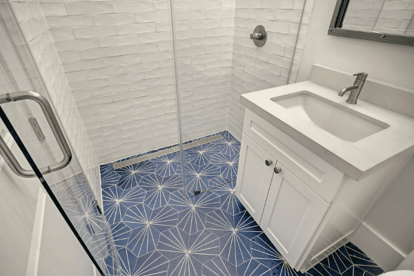Luxury Home Bathroom with blue Tile and Single Sink