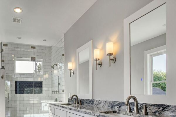 Custom Home Bathroom Remodel with a Double Vanity and Industrial Light Fixtures