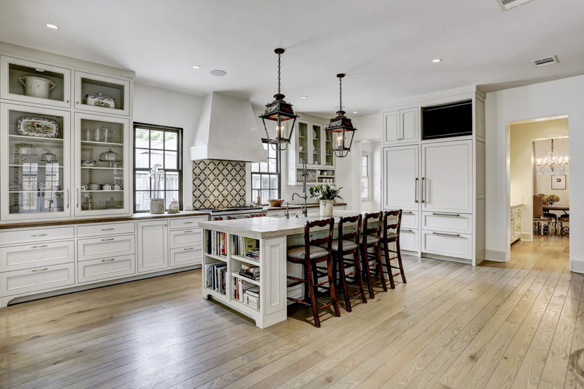 Kitchen with repurposed French antique light fixtures
