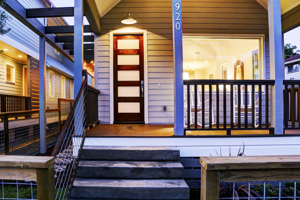 Custom Farm House Patio With A Red Wood Door And Energy Efficient Windows