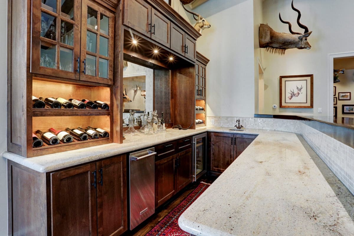 Custom wood bar with stainless steel appliances and bar sink in Houston, Texas