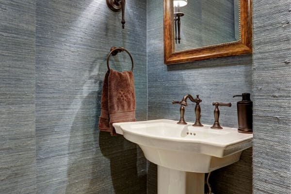 Custom pedestal sink in Houston bathroom remodel by Southern Green Builders
