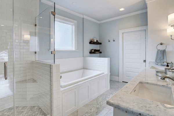 Custom Home Bathroom in Houston Texas with a Double Vanity and Custom Storage Space Under The Bathtub