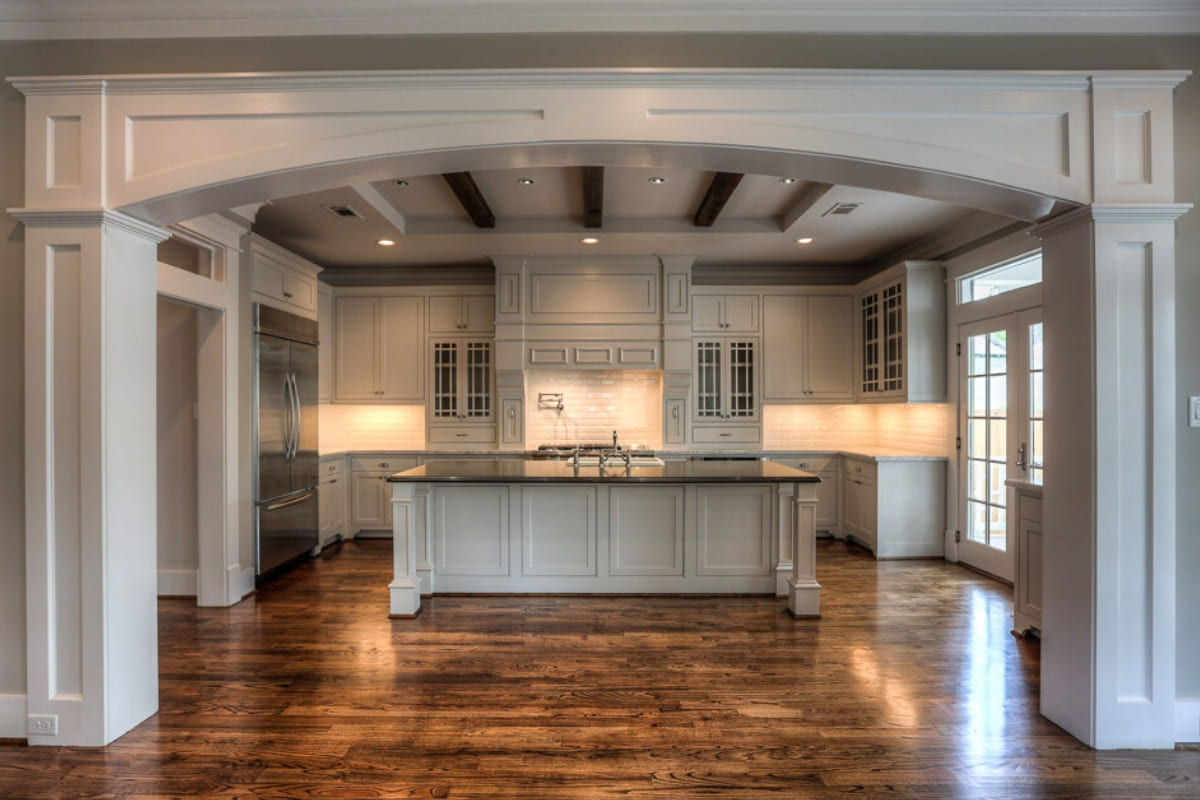 Custom luxury kitchen in Houston with exposed wooden ceiing beams