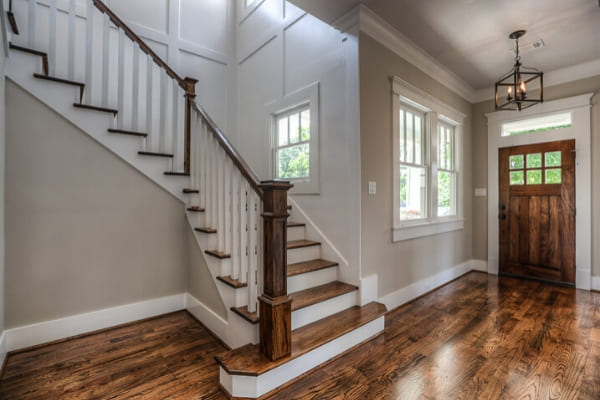 Entryway with antique style lighting in Houston, Texas home