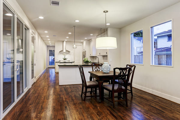 An Open Modern Farmhouse Dining Room With A View of The Outdoor Deck