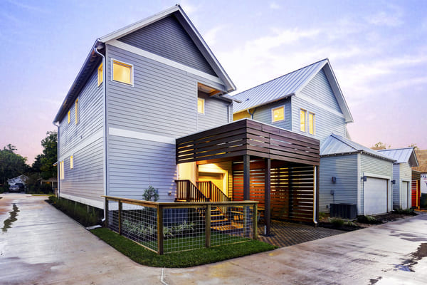 Backyard of A Light Blue Two-Story Custom Farmhouse in Houston Texas